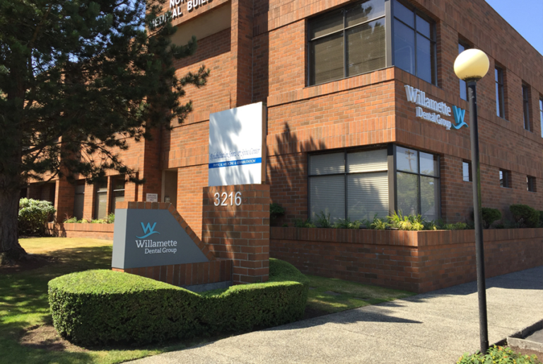 The new Everett office location, a brick building with location signage in front